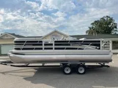 Slide: The Image of 2023 Sweetwater 2286SFL pontoon boat on a trailer. - 13