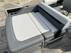 Slide: The Image of 2023 Sweetwater 2286SFL boat with gray and white cushioned seating. - 8