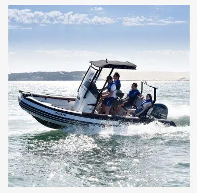 Slide: The Image of 2023 Zodiac Open 5.5 PVC boat storage compartment with visible wiring and red rope. - 18