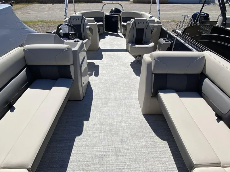 Slide: The Image of 2023 Harris Cruiser 250 CWDH pontoon boat interior with spacious seating and modern design. - 10