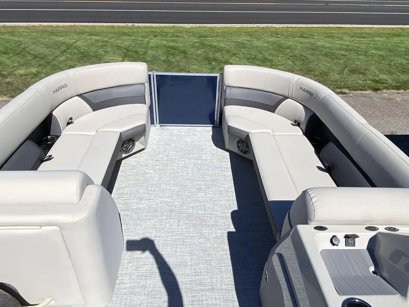 Slide: The Image of 2023 Harris Cruiser 250 CWDH pontoon boat interior with spacious seating and modern design. - 8