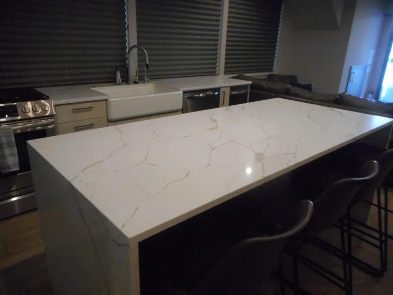 Slide: The Image of Modern kitchen with marble island, farmhouse sink, and stainless steel appliances in Adonia Pace Share #8, 2021. - 12