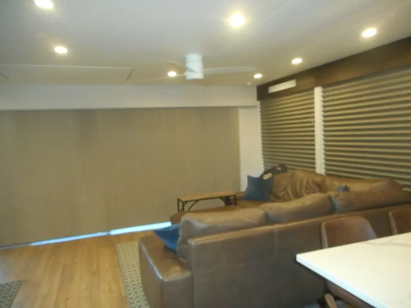 Slide: The Image of Modern living area in Adonia Pace Share #8, 2021 model, featuring leather sofa and wooden flooring. - 13