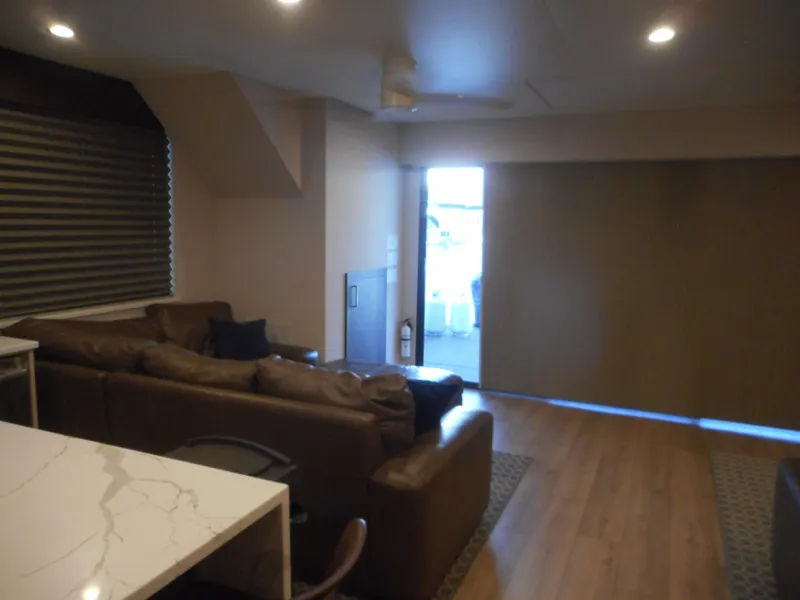 Slide: The Image of Modern living area in Adonia Pace Share #8, 2021 model, featuring a cozy brown leather sofa. - 14