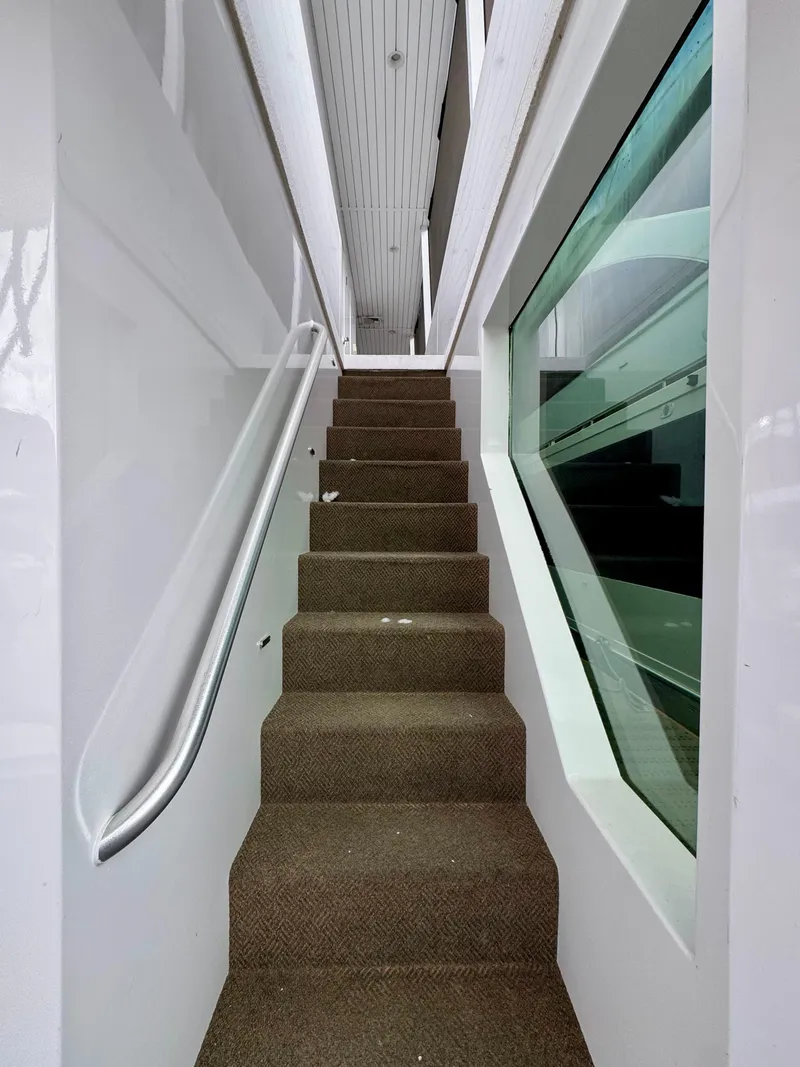 Slide: The Image of Staircase inside Adonia Pace Trip #7, 2021 model, with modern design and large window. - 22