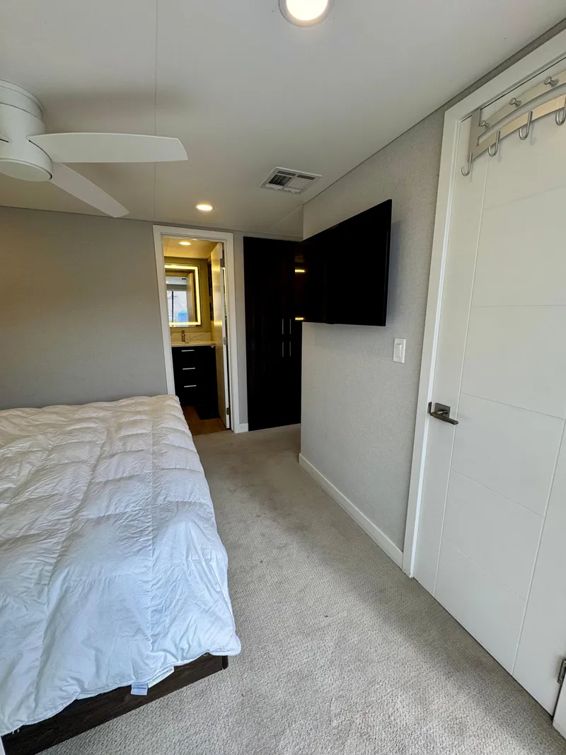Slide: The Image of Modern bedroom in 2021 Adonia Pace Trip #7 RV with TV and ceiling fan. - 25