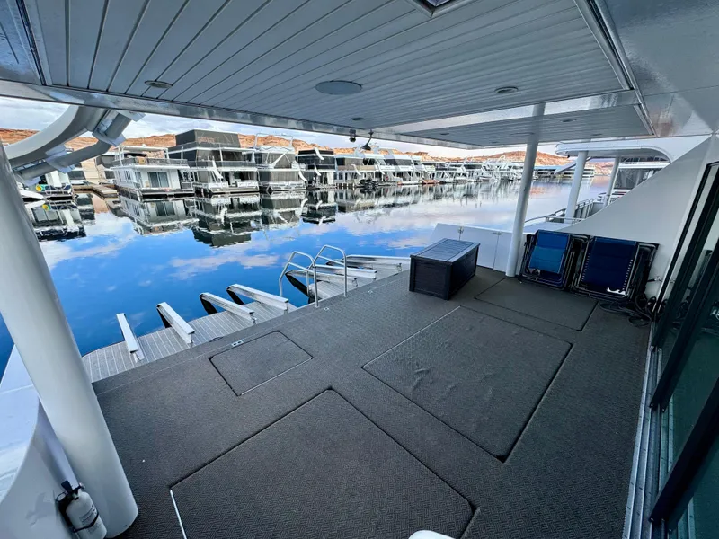 Slide: The Image of Spacious deck of Adonia Pace Trip #7 houseboat, 2021, overlooking calm marina waters. - 46