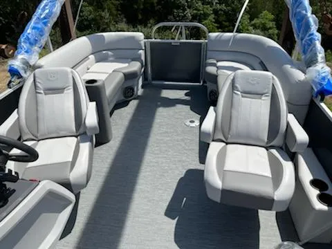 Slide: The Image of 2023 Sweetwater 2286SBCX pontoon boat interior with plush seating and modern design. - 7