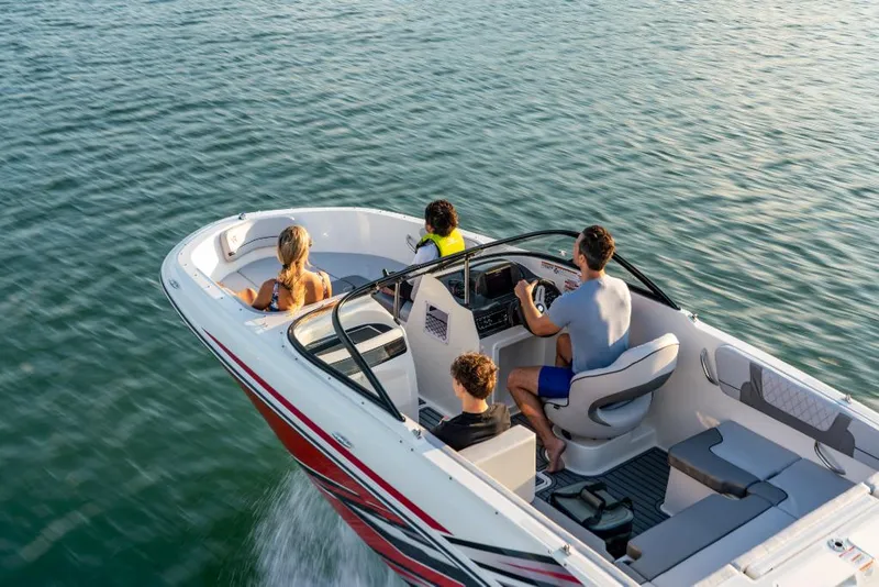 Slide: The Image of 2023 Bayliner M17 boat cruising with four passengers on a sunny day. - 13