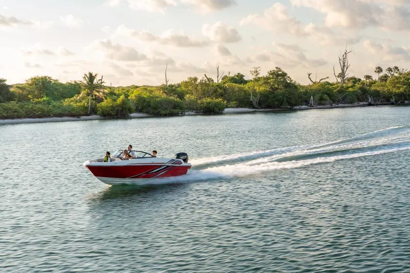 Slide: The Image of 2023 Bayliner M17 boat cruising on a scenic waterway. - 15
