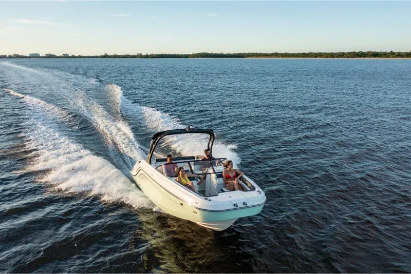 Slide: The Image of 2023 Bayliner DX2000 boat cruising on open water. - 0