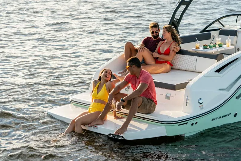 Slide: The Image of 2023 Bayliner DX2000 boat with friends enjoying the water. - 30