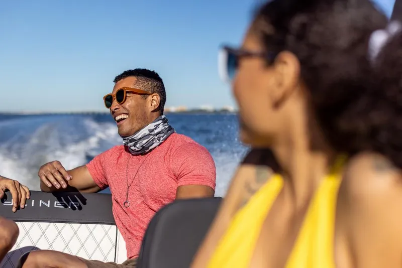 Slide: The Image of People enjoying a ride on a 2023 Bayliner DX2000 boat. - 40