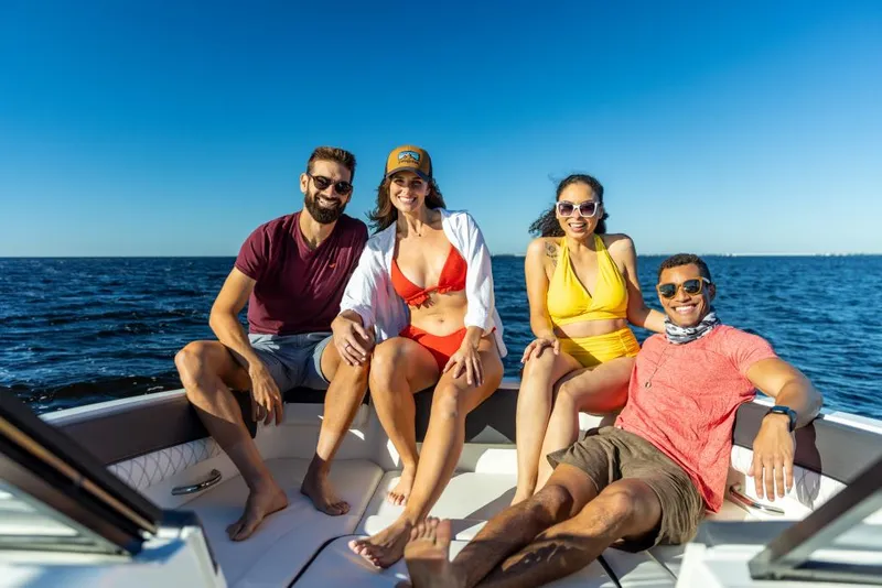 Slide: The Image of Friends enjoying a sunny day on a 2023 Bayliner DX2050 boat. - 38