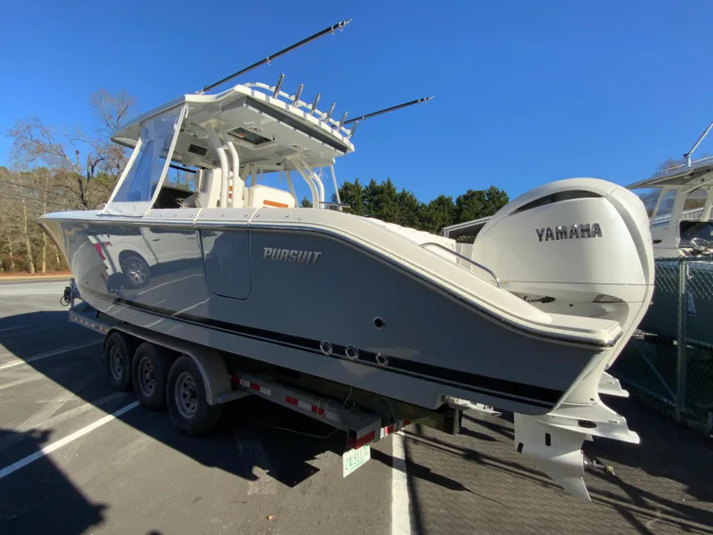 Slide: The Image of 2024 Pursuit S 328 Sport boat with Yamaha engines on a trailer. - 17