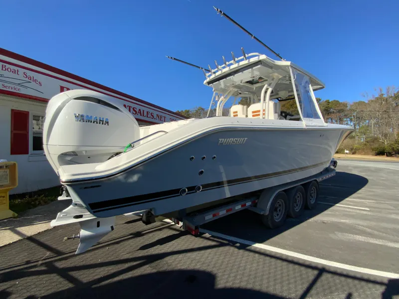 Slide: The Image of 2024 Pursuit S 328 Sport boat on a trailer, side view, with Yamaha engines. - 18