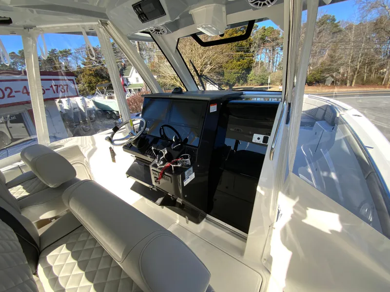 Slide: The Image of 2024 Pursuit S 328 Sport boat interior with modern helm and seating. - 22