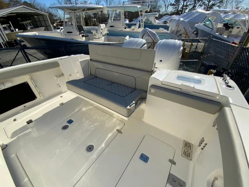 Slide: The Image of 2024 Pursuit S 328 Sport boat interior with seating and storage compartments. - 27