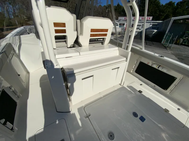 Slide: The Image of 2024 Pursuit S 328 Sport boat interior with seating and storage compartments. - 32