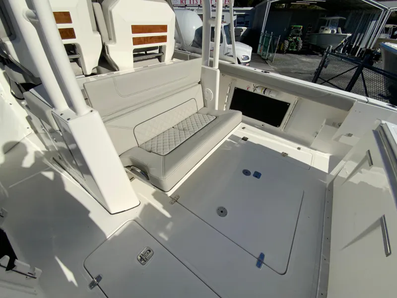 Slide: The Image of 2024 Pursuit S 328 Sport boat interior with seating and storage compartments. - 34