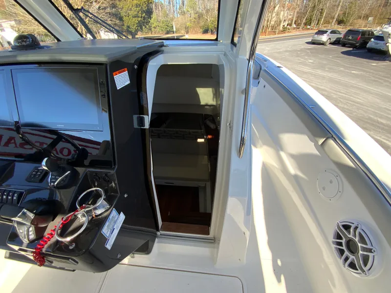Slide: The Image of 2024 Pursuit S 328 Sport boat interior cabin entrance. - 38