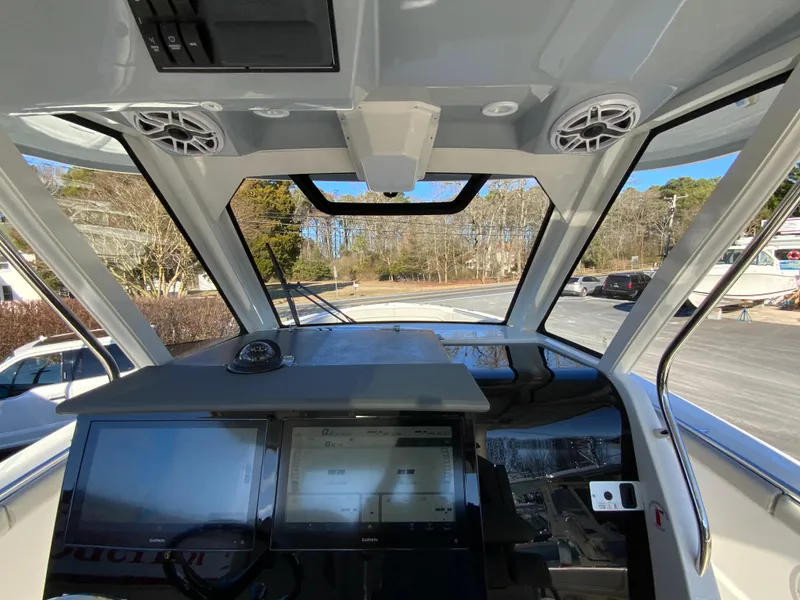 Slide: The Image of 2024 Pursuit S 328 Sport boat cockpit with advanced navigation system. - 43