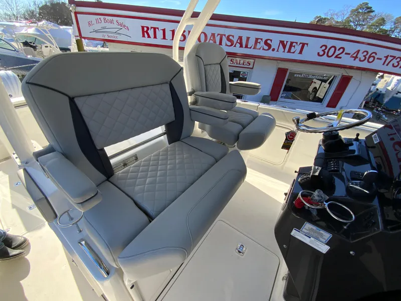 Slide: The Image of 2024 Pursuit S 328 Sport boat interior with luxurious seating and modern helm. - 46