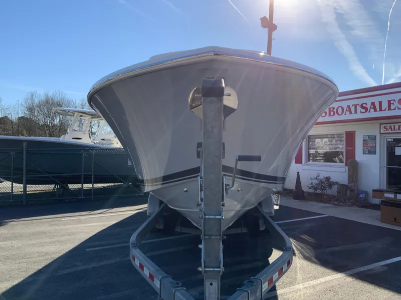 Slide: The Image of 2024 Pursuit S 328 Sport boat on trailer at dealership. - 5