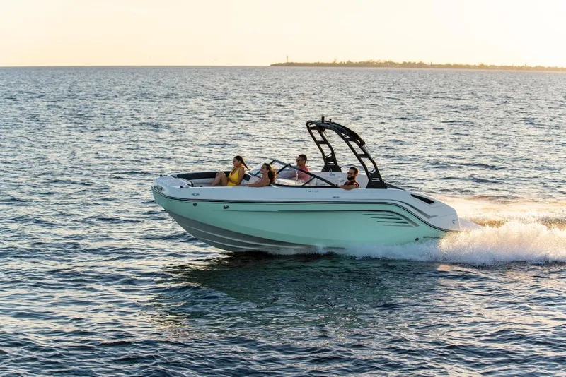 Slide: The Image of 2023 Bayliner DX2250 boat cruising on open water with passengers. - 7