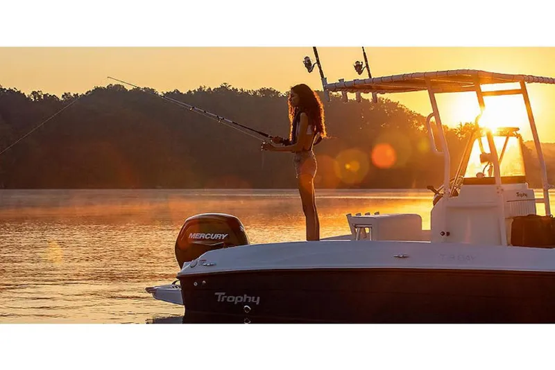 Slide: The Image of 2023 Bayliner T18 boat at sunset with person fishing. - 7