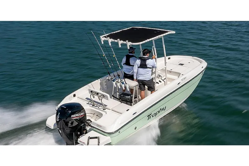 Slide: The Image of 2023 Bayliner T21 boat cruising on water with two people onboard. - 4