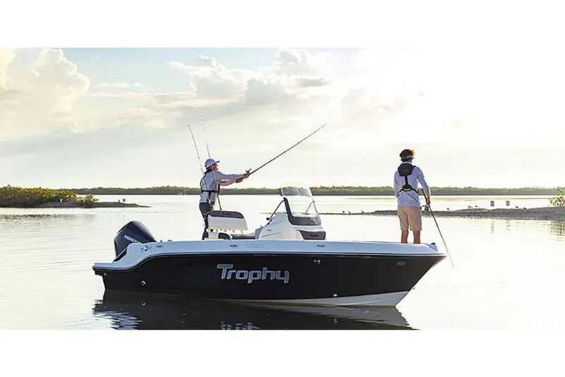 Slide: The Image of 2023 Bayliner T20 CC boat with two people fishing on calm water. - 3