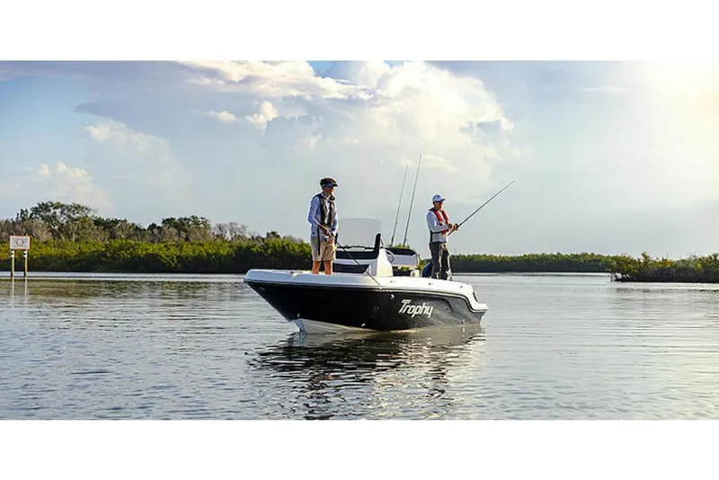 Slide: The Image of 2023 Bayliner T20 CC boat with two people fishing on calm water. - 4