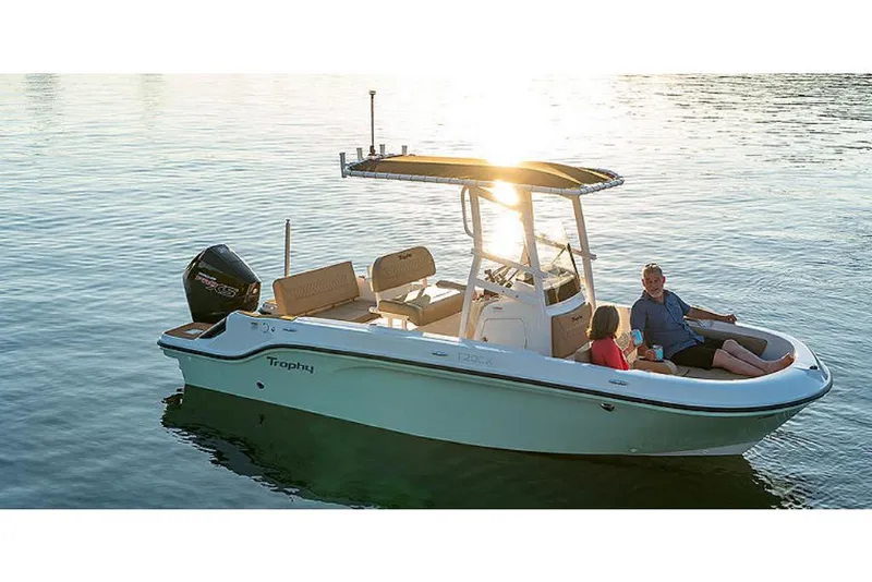 Slide: The Image of 2023 Bayliner T20 CX boat on water at sunset with passengers. - 0
