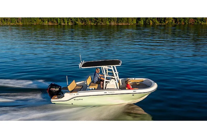 Slide: The Image of 2023 Bayliner T20 CX boat cruising on a calm lake. - 3
