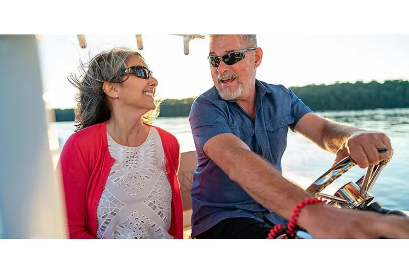Slide: The Image of Couple enjoying a ride on a 2023 Bayliner T20 CX boat. - 8