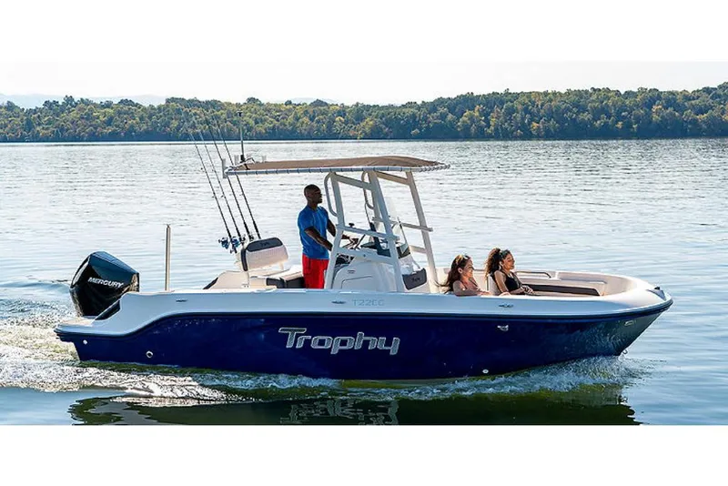 Slide: The Image of 2023 Bayliner T22 CC boat cruising on a lake with passengers. - 4