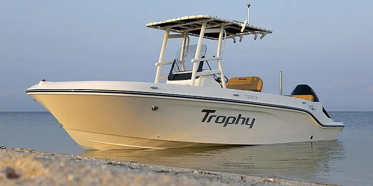 Slide: The Image of 2023 Bayliner T22 CX Trophy boat on calm water. - 3