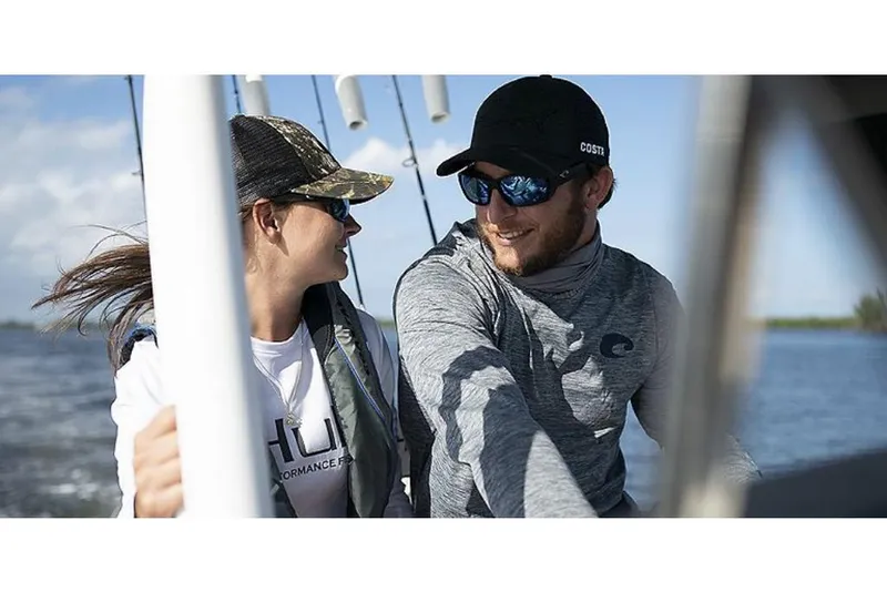 Slide: The Image of Couple enjoying a ride on a 2023 Bayliner T24 CC boat. - 3