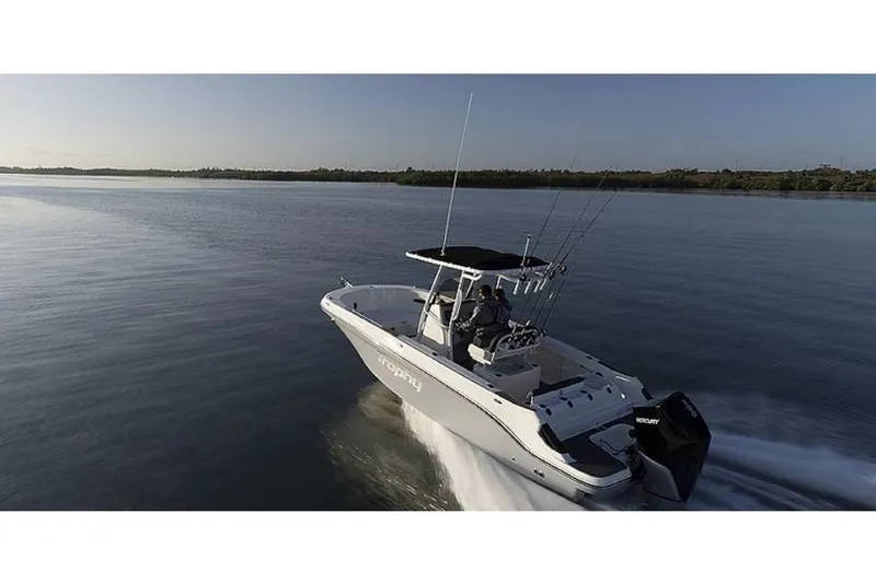 Slide: The Image of 2023 Bayliner T24 CC boat cruising on calm water. - 7