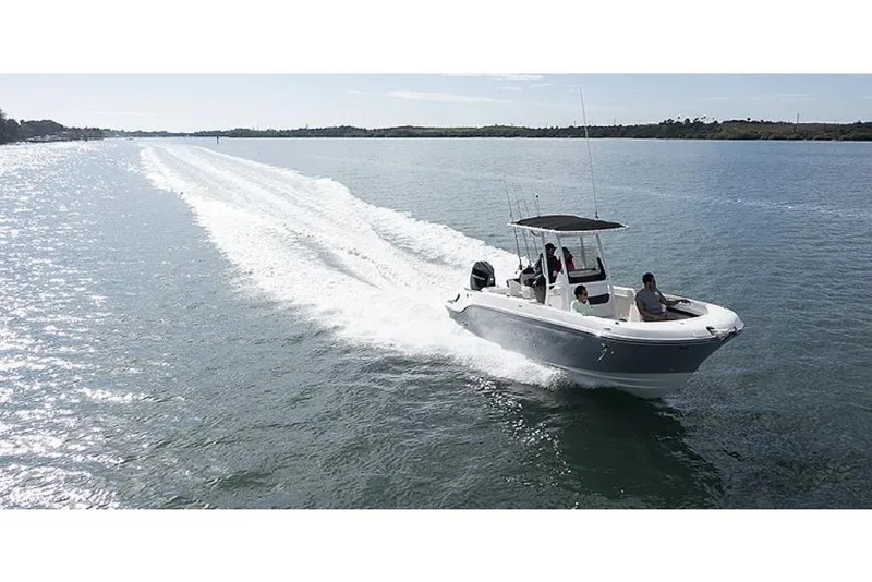 Slide: The Image of 2023 Bayliner T24 CC boat cruising on a sunny day. - 8