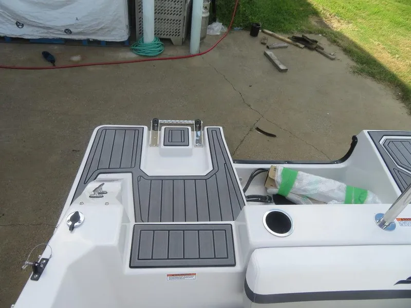 Slide: The Image of 2023 Starcraft SVX 191 OB boat deck with gray non-slip flooring. - 15