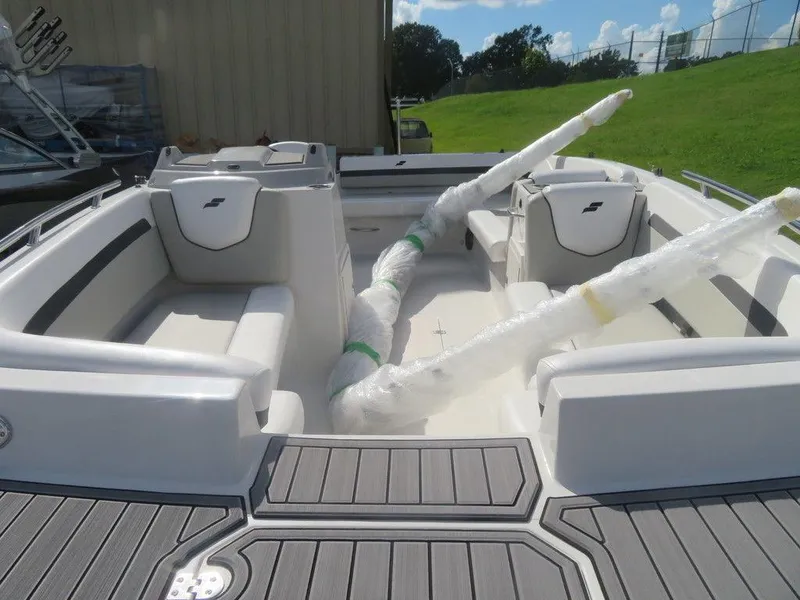 Slide: The Image of 2023 Starcraft SVX 191 OB boat interior with cushioned seating and wrapped components. - 3
