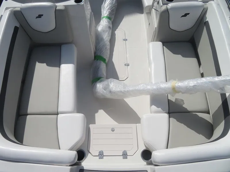 Slide: The Image of 2023 Starcraft SVX 191 OB boat interior with cushioned seating and wrapped components. - 7