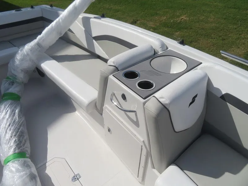 Slide: The Image of 2023 Starcraft SVX 191 OB boat interior with seating and cup holders. - 8