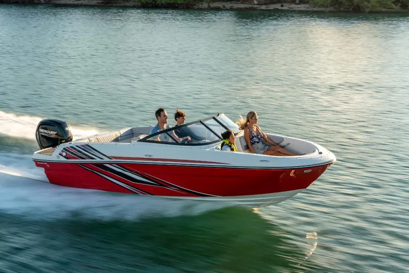 Slide: The Image of 2023 Bayliner VR4 Bowrider speeding on water with passengers. - 18