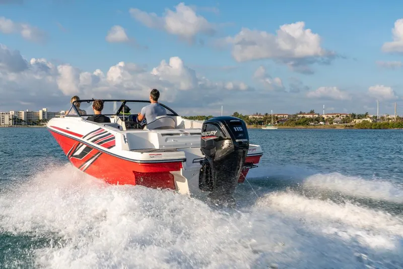 Slide: The Image of 2023 Bayliner VR4 Bowrider speeding on water with passengers. - 20