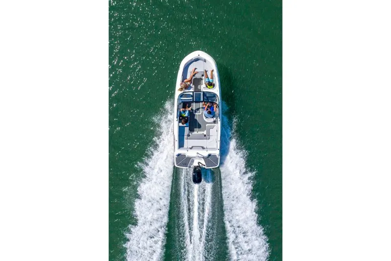 Slide: The Image of 2023 Bayliner VR4 Bowrider cruising on open water, aerial view. - 34