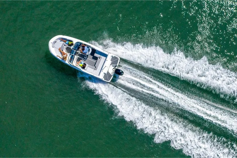 Slide: The Image of 2023 Bayliner VR4 Bowrider speeding on water, aerial view. - 35