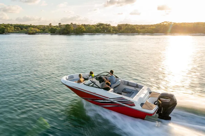 Slide: The Image of 2023 Bayliner VR4 Bowrider cruising on a lake at sunset. - 9